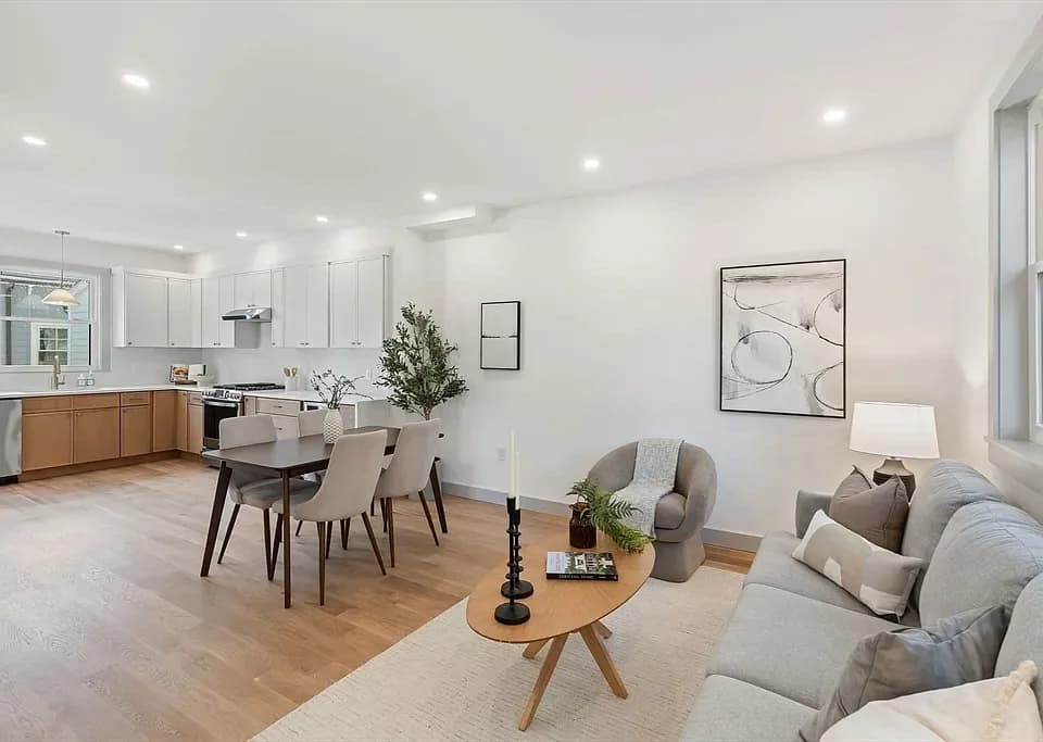 Open-plan kitchen, dining and living room remodeled by KNT Construction
